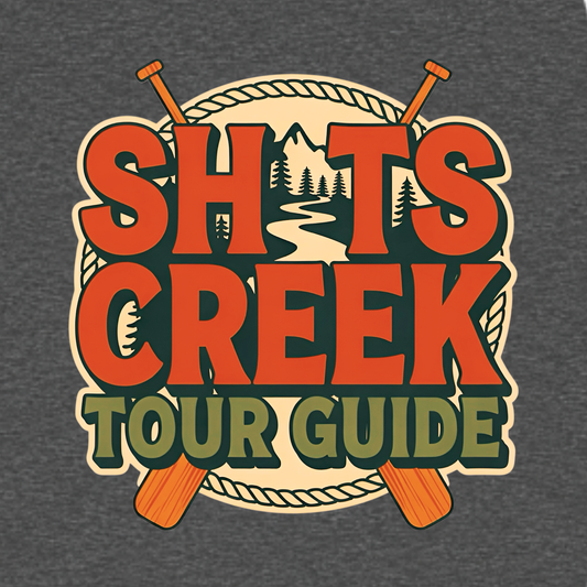 Shits Creek Tour Guide graphic T-shirt featuring bold retro lettering with crossed paddles, rope, mountains, pine trees and a winding creek - charcoal